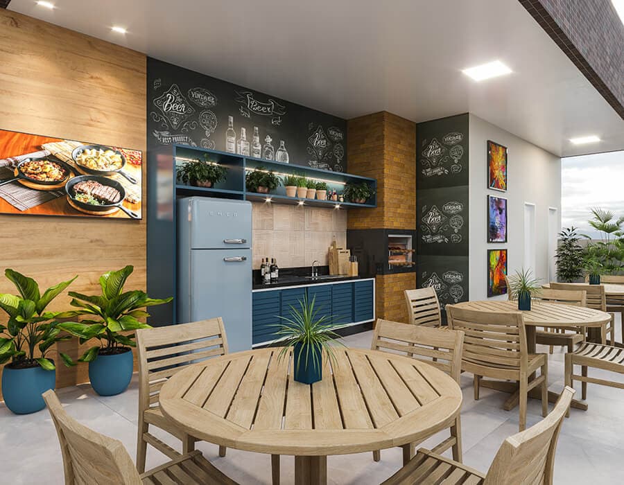 Espaço grill do Next Residence, com churrasqueira e mesas de apoio